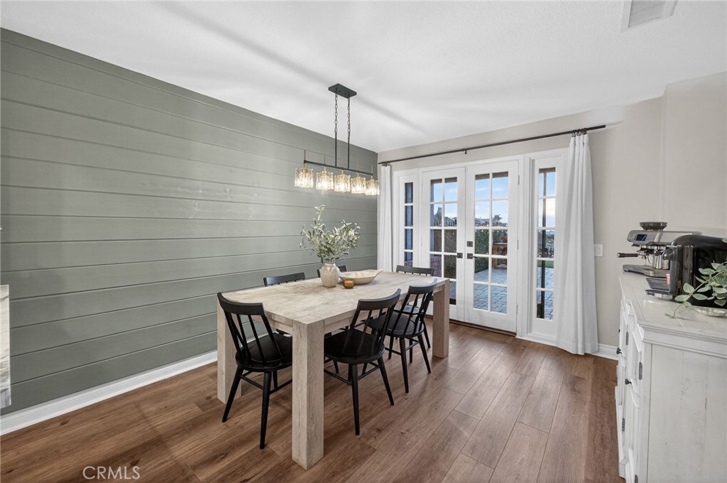 964 South Rim Crest Drive Anaheim, CA 92807 - Photo 30 of 69 a view of a dining room with furniture window and wooden floor