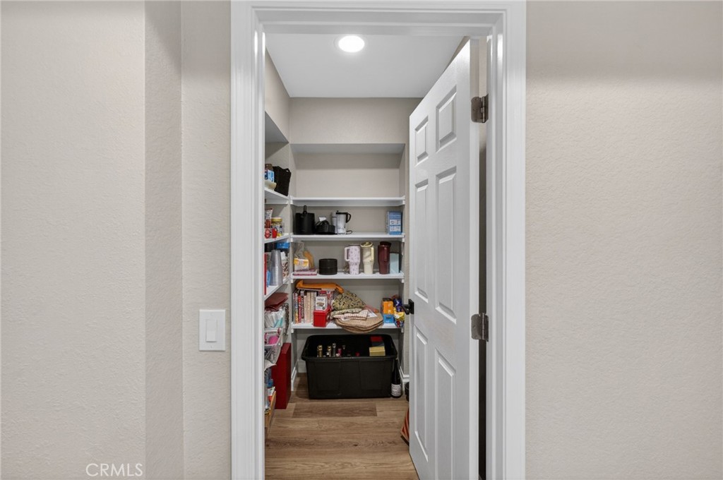 964 South Rim Crest Drive Anaheim, CA 92807 - Photo 31 of 69 a view of walk in closet with clothes and shoes