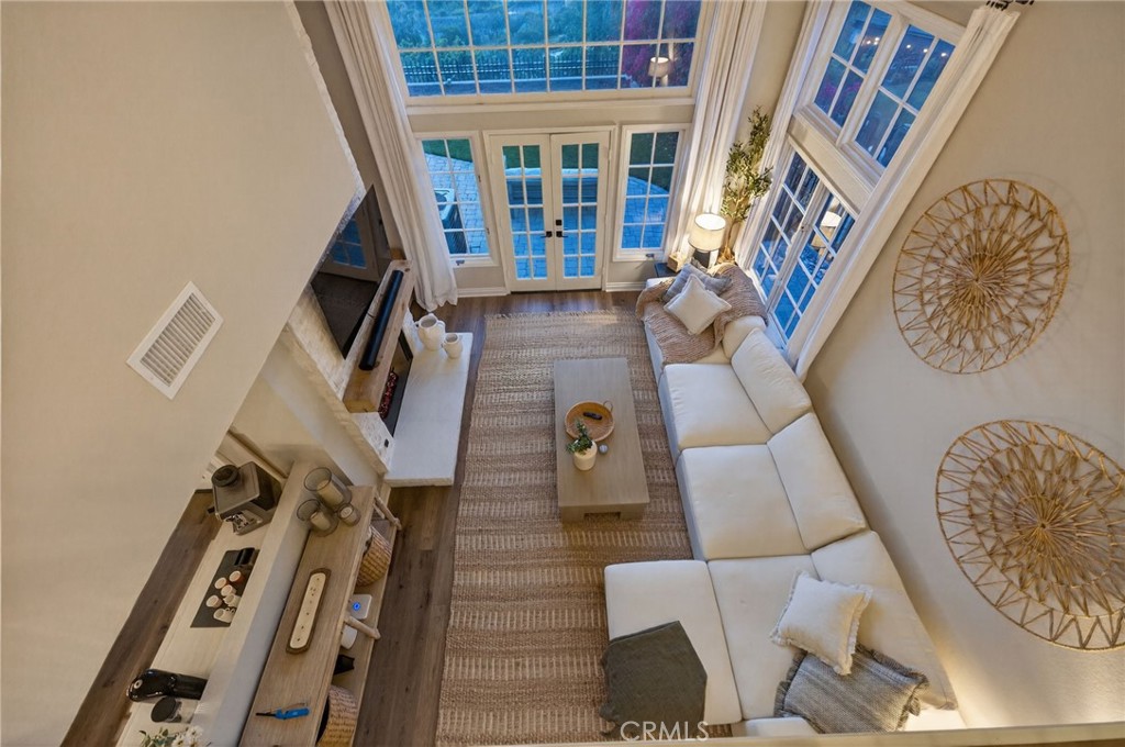 964 South Rim Crest Drive Anaheim, CA 92807 - Photo 33 of 69 a view of an living room with furniture and a floor to ceiling window