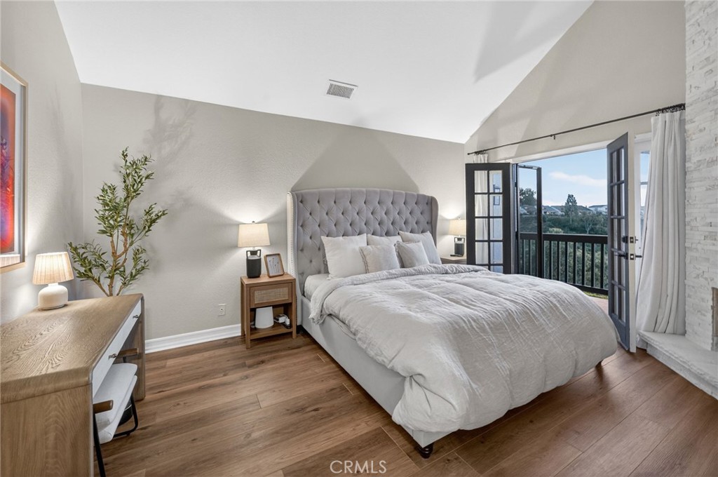 964 South Rim Crest Drive Anaheim, CA 92807 - Photo 36 of 69 a bedroom with a large bed and a potted plant