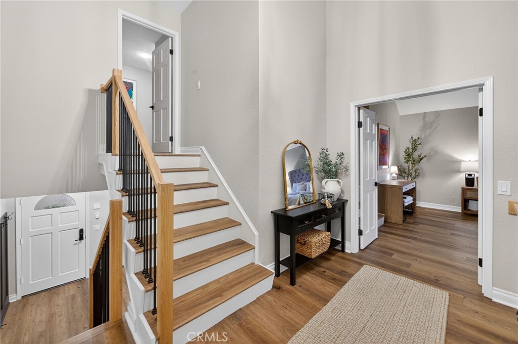 964 South Rim Crest Drive Anaheim, CA 92807 - Photo 45 of 69 a view of a hallway with wooden floor and staircase
