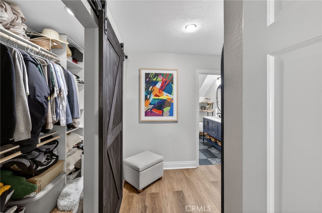964 South Rim Crest Drive Anaheim, CA 92807 - Photo 53 of 69 a view of walk in closet with clothes and shoes