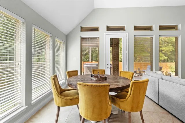 a dining room with furniture and windows