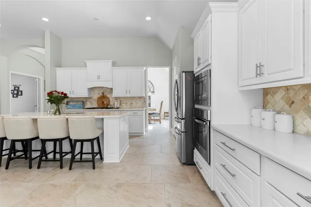 a kitchen with a sink and refrigerator