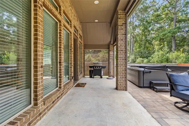 a front view of house with outdoor seating and yard