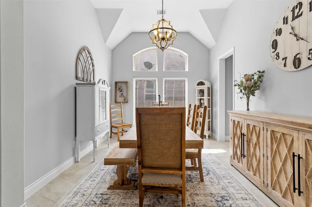 workspace with wooden floor and a chandelier