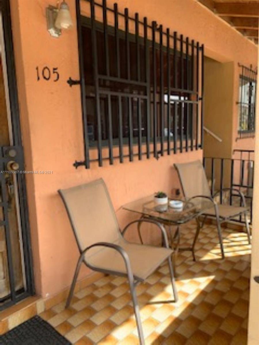 Hialeah Hialeah, FL 33016 - Photo 2 of 8 a view of a patio with table and chairs and wooden floor