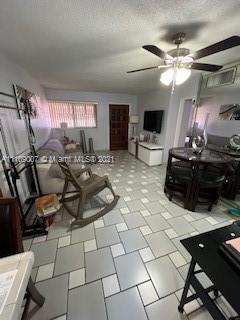 Hialeah Hialeah, FL 33016 - Photo 3 of 8 a living room with furniture and a flat screen tv