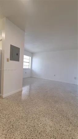 a bedroom with a bed and a table
