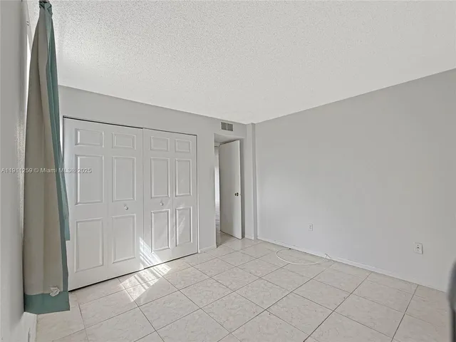 an empty room with a wooden door