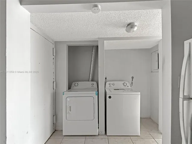 a bathroom with a toilet and shower