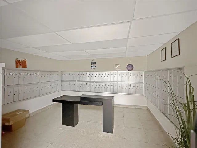 a room with lots of counter space and chandelier