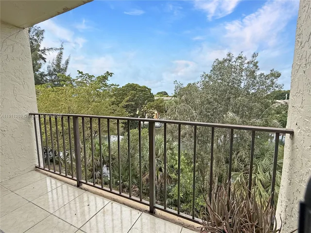 a view of balcony with wooden floor
