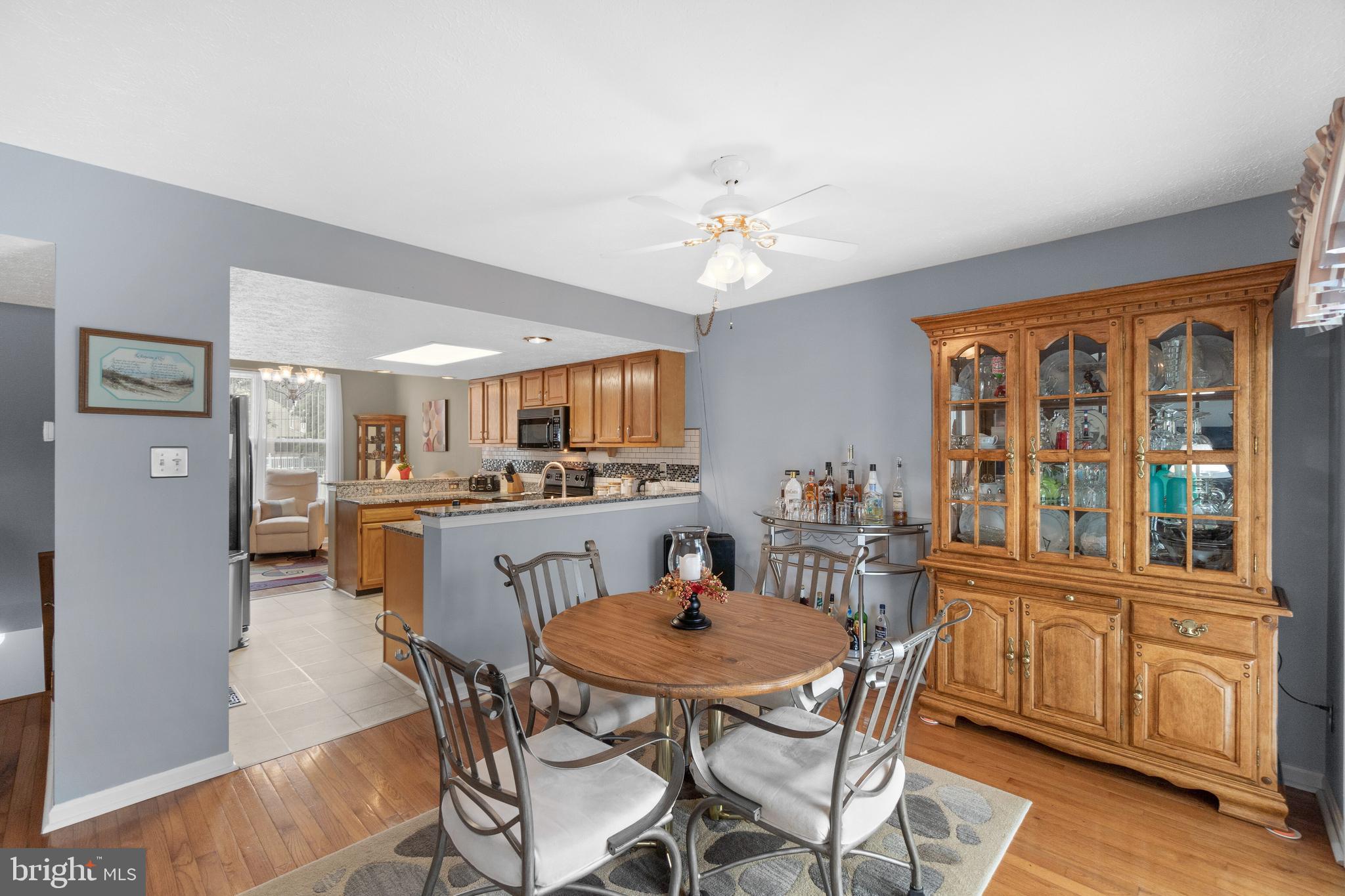 7708 West Shore Road Pasadena, MD 21122 - Photo 11 of 31 Dining area with slider to deck