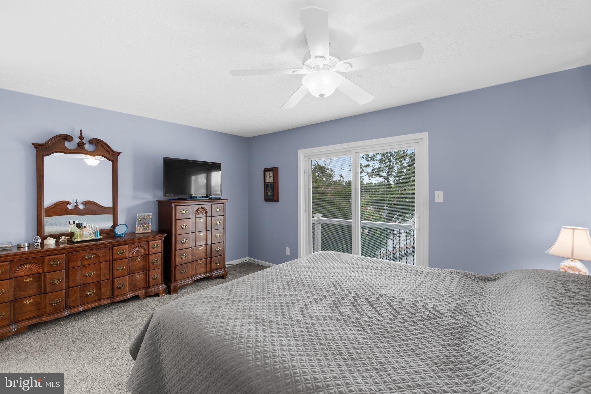 7708 West Shore Road Pasadena, MD 21122 - Photo 14 of 31 Primary bedroom with balcony overlooking the water