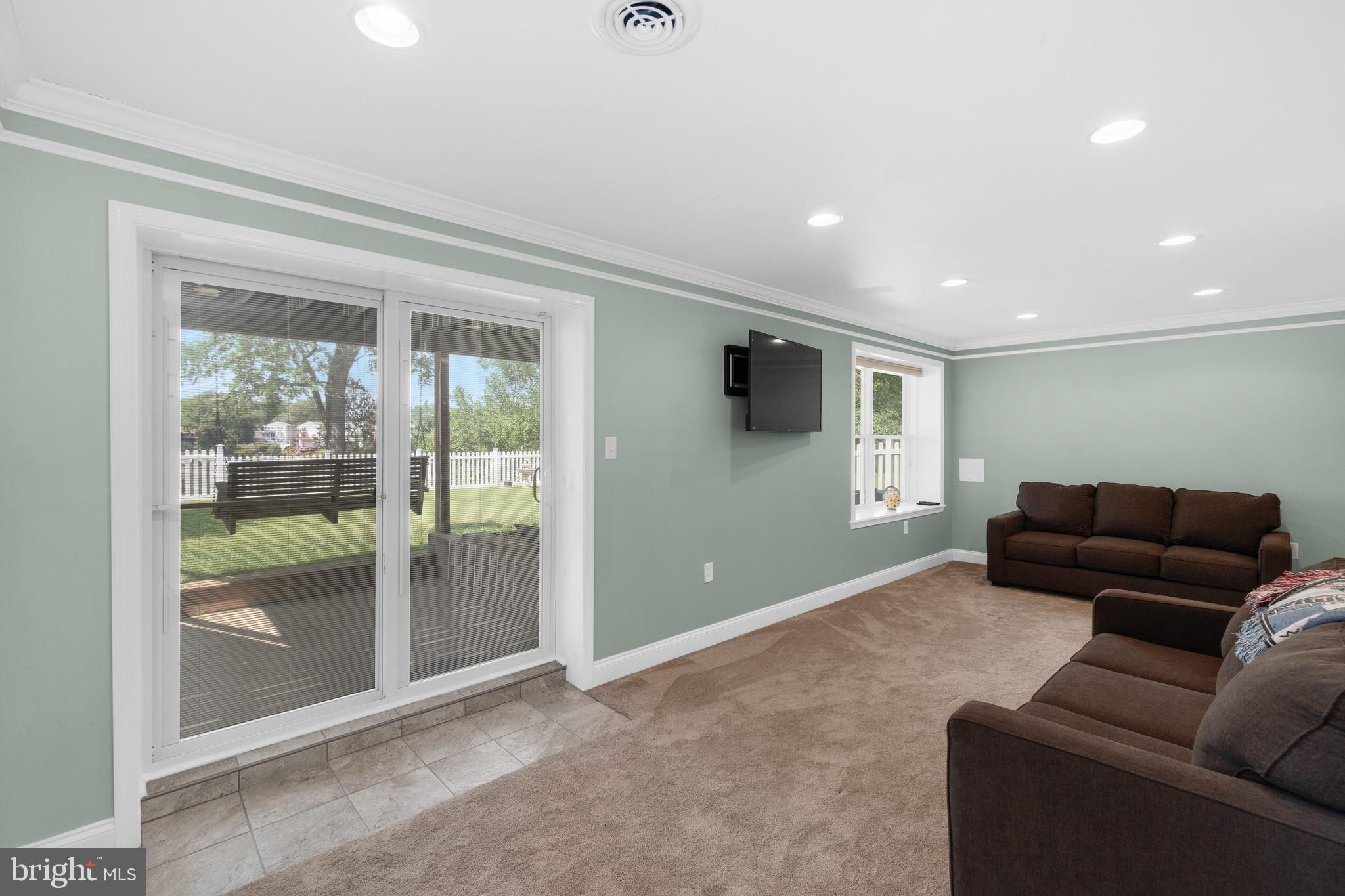 7708 West Shore Road Pasadena, MD 21122 - Photo 21 of 31 Newly finished lower level with walk out to yard