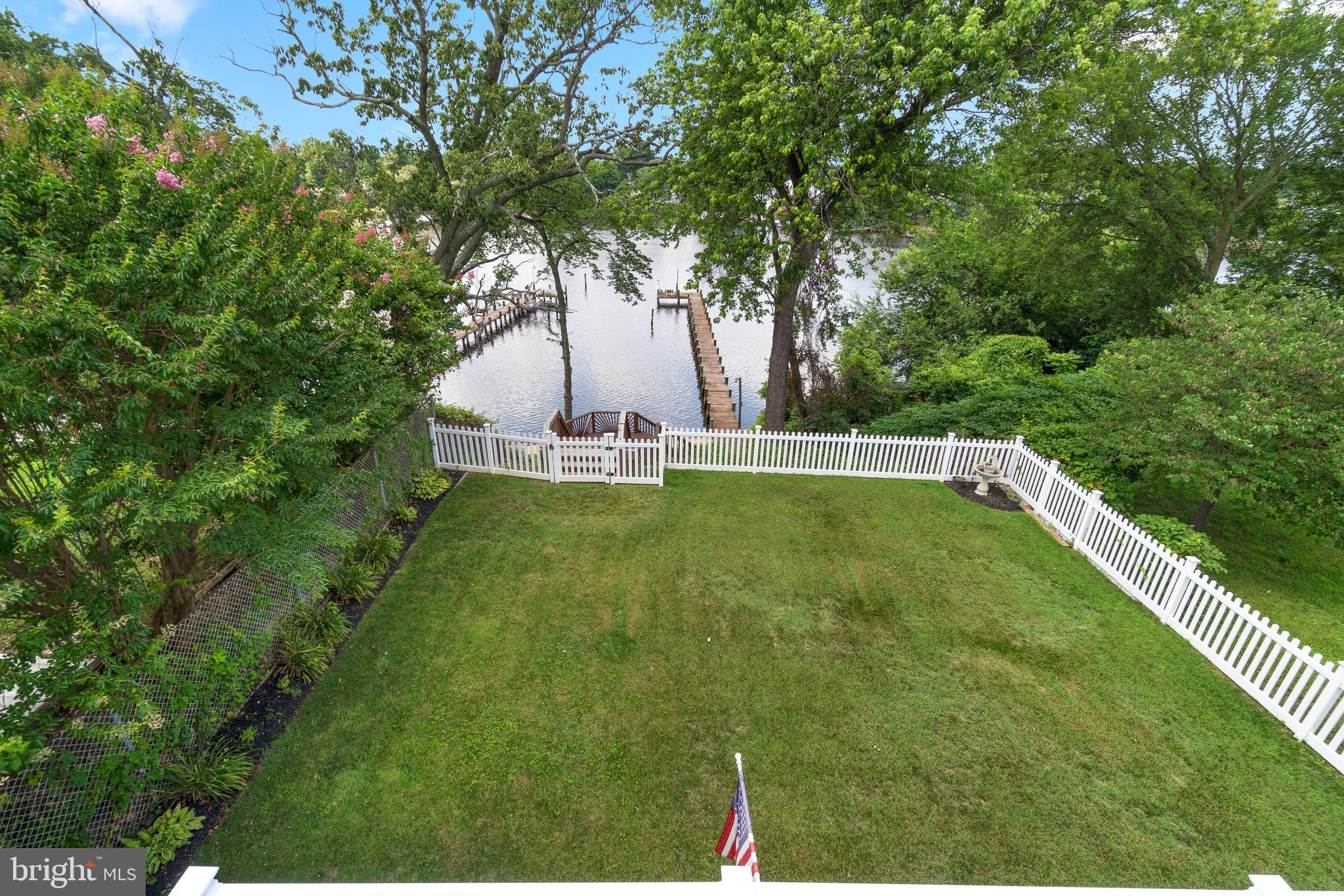 7708 West Shore Road Pasadena, MD 21122 - Photo 25 of 31 Fully fenced rear yard leading to water and beach