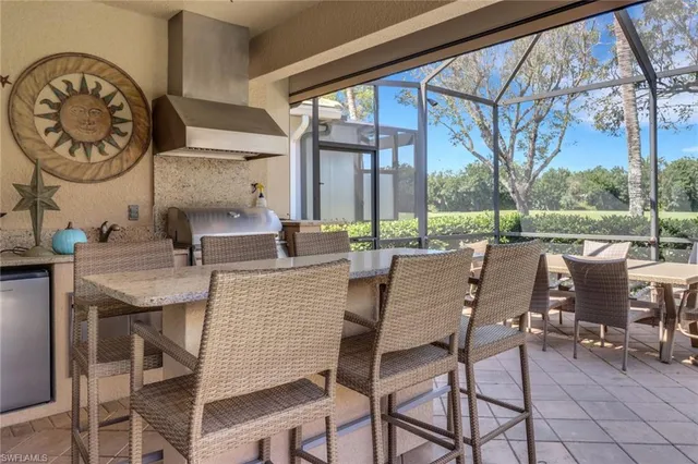a dining area with a table and chairs