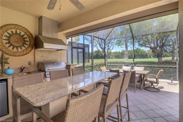 a dining room with furniture and a floor to ceiling window