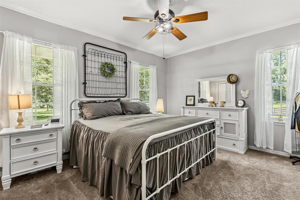 32530 Senese Road Sorrento, FL 32776 - Photo 23 of 34 a bedroom with a bed and a window