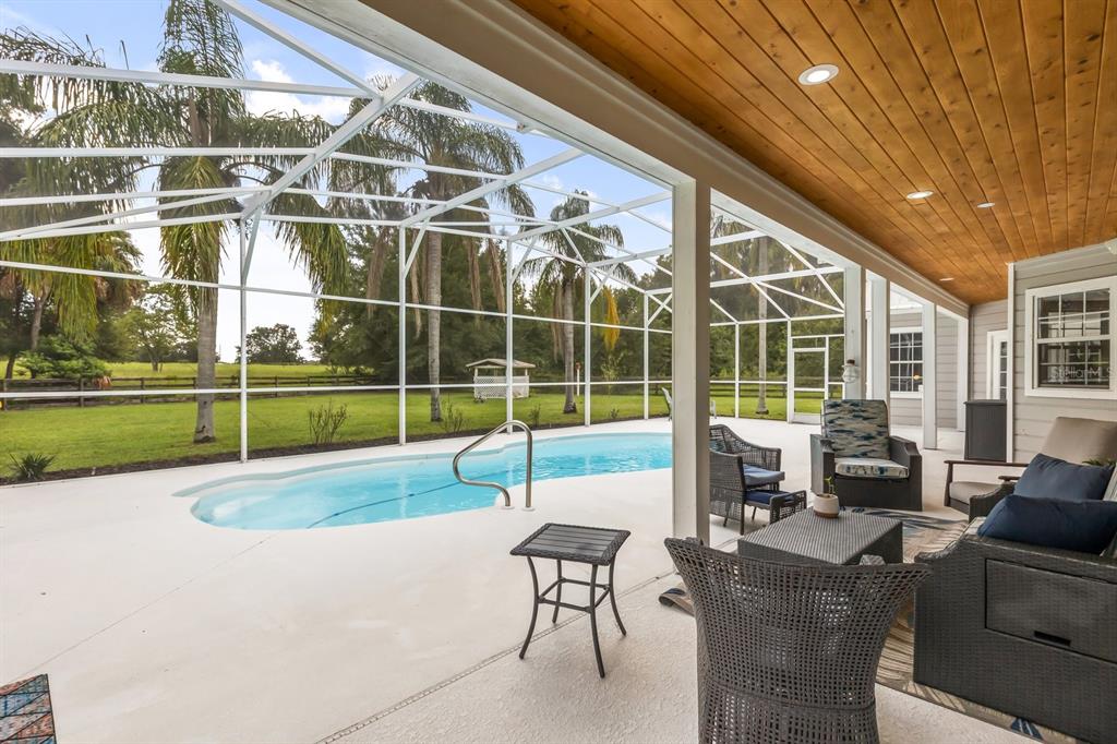 32530 Senese Road Sorrento, FL 32776 - Photo 27 of 34 a view of a patio with a table and chairs