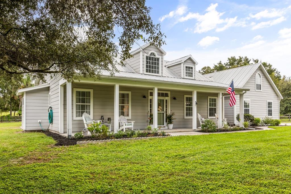 32530 Senese Road Sorrento, FL 32776 - Photo 7 of 34 a front view of house with yard and green space