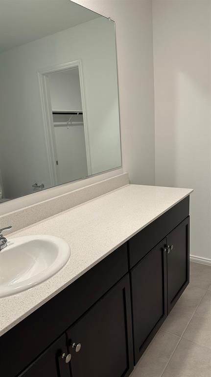 14821 Firerock Road Haslet, TX 76052 - Photo 11 of 35 a bathroom with a sink and a mirror