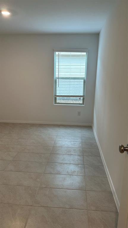 14821 Firerock Road Haslet, TX 76052 - Photo 15 of 35 an empty room with windows