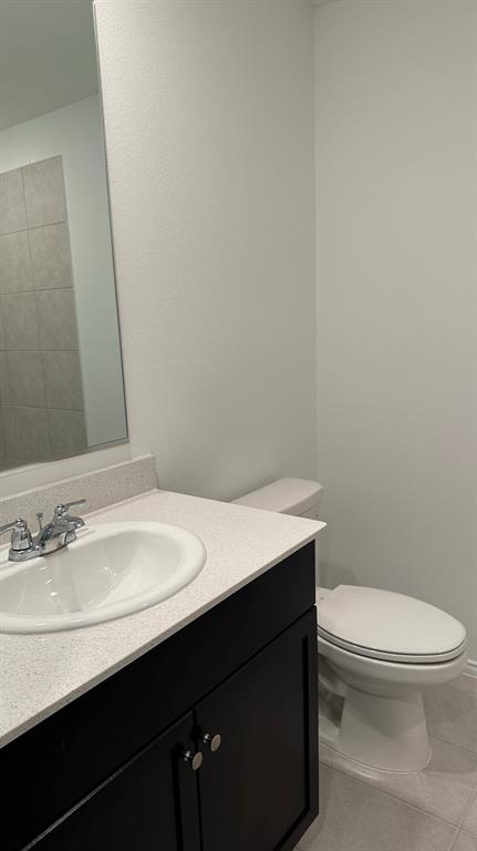 14821 Firerock Road Haslet, TX 76052 - Photo 18 of 35 a bathroom with a sink a toilet and mirror