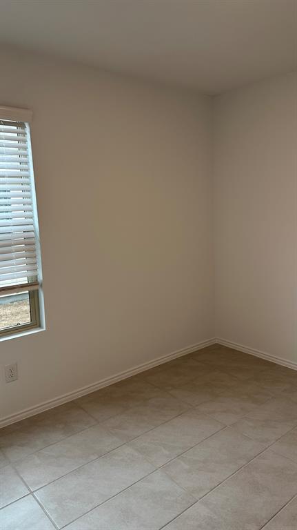 14821 Firerock Road Haslet, TX 76052 - Photo 20 of 35 an empty room with a window