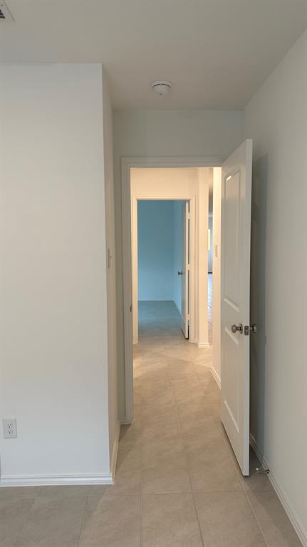 14821 Firerock Road Haslet, TX 76052 - Photo 22 of 35 an empty room with closet and a bathroom