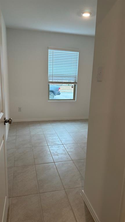 14821 Firerock Road Haslet, TX 76052 - Photo 25 of 35 a view of an empty room with a window