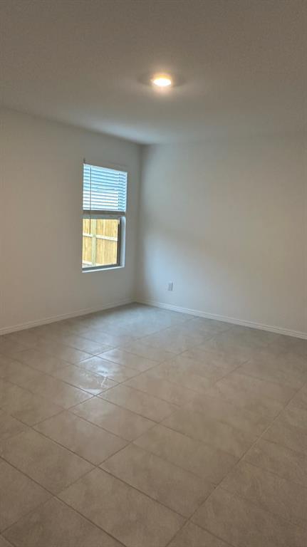 14821 Firerock Road Haslet, TX 76052 - Photo 28 of 35 an empty room with a empty space and a window