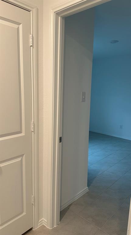 14821 Firerock Road Haslet, TX 76052 - Photo 29 of 35 a view of a hallway with wooden floor