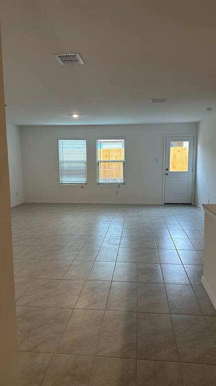 14821 Firerock Road Haslet, TX 76052 - Photo 4 of 35 a view of an empty room with a window