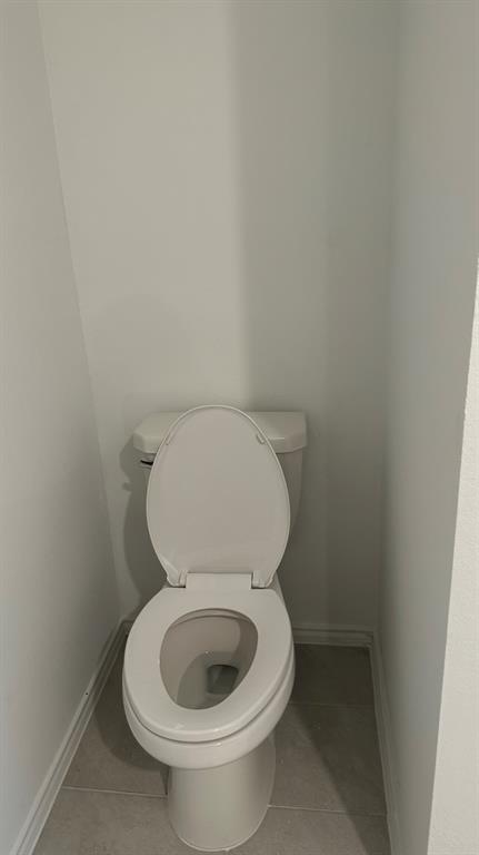 14821 Firerock Road Haslet, TX 76052 - Photo 9 of 35 a white toilet sitting next to a small window