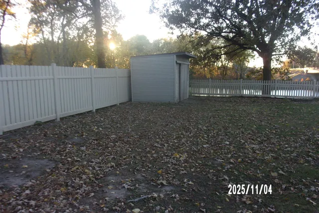 a backyard of a house with lots of green space