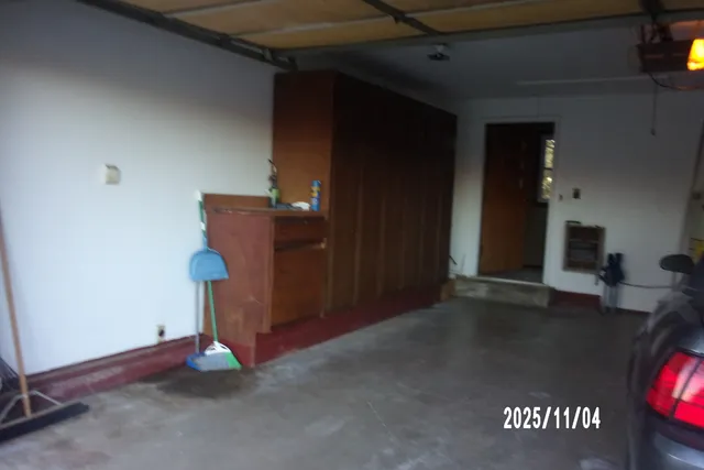 a view of a kitchen with stainless steel appliances granite countertop wooden cabinets