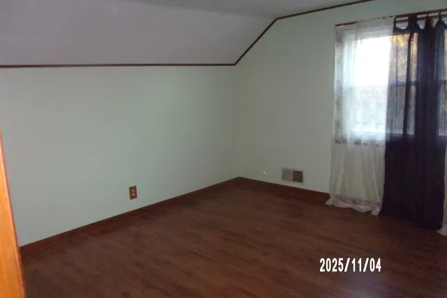 an empty room with an entrance door