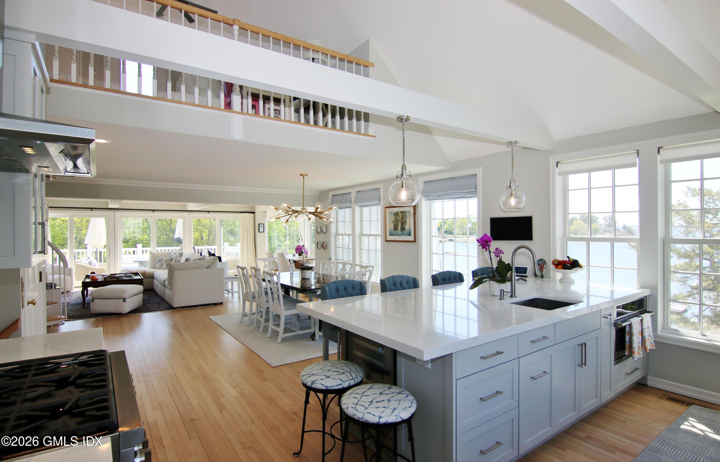 633 Steamboat Road, Unit 5 Greenwich, CT 06830 - Photo 19 of 29 a kitchen with sink refrigerator and large window
