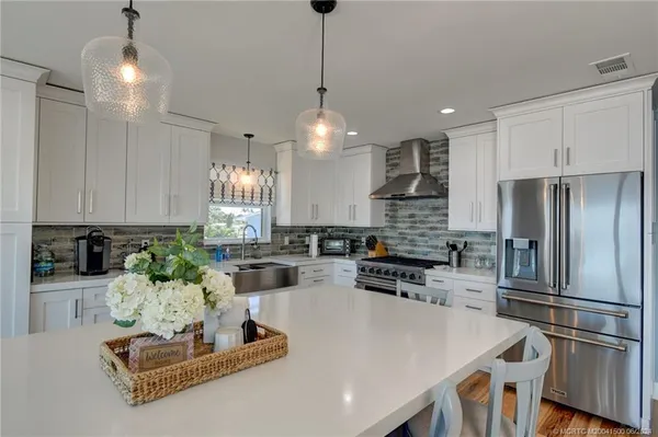 a bedroom with a bed and a ceiling fan