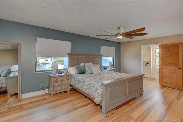 a room that has a window and a dresser