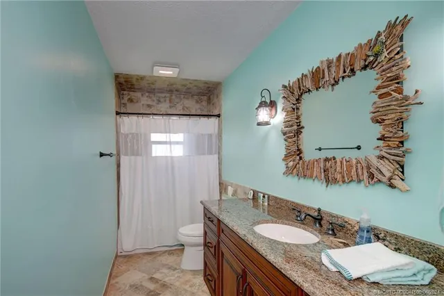 a view of a dining room with furniture and a fireplace