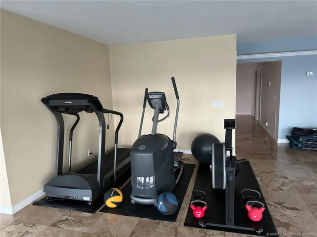 a bathroom with a granite countertop double vanity sink and a mirror