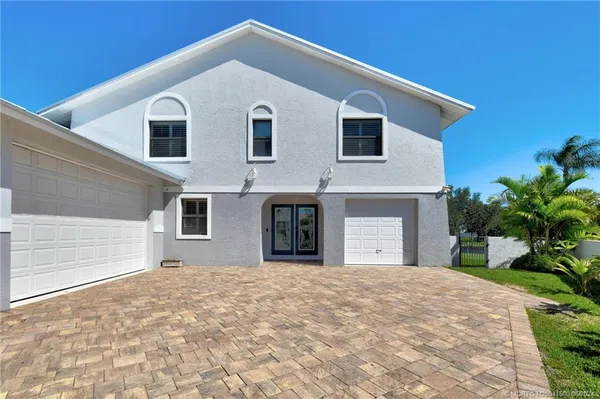 a view of a swimming pool with a yard