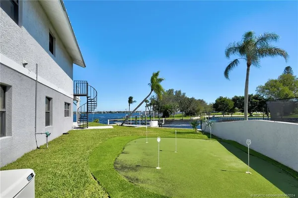 a view of a swimming pool with a lake view
