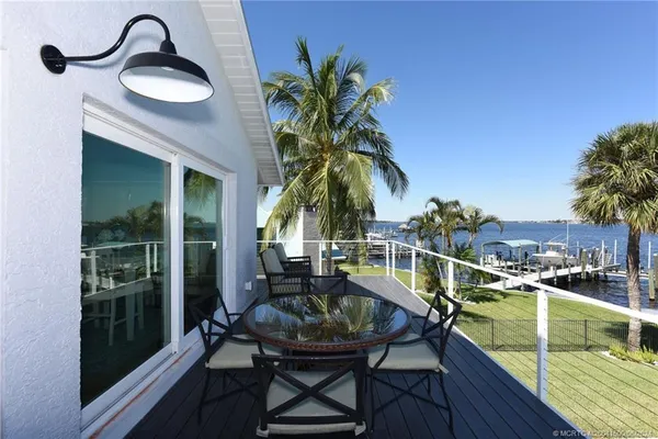 an aerial view of residential houses with outdoor space and street view