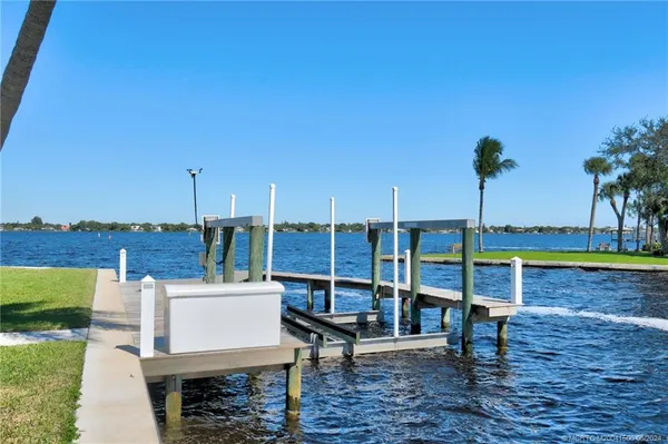 an aerial view of a house with a lake view