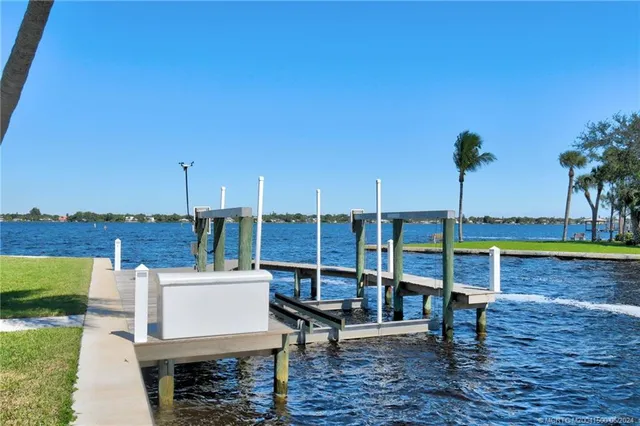 an aerial view of a house with a lake view