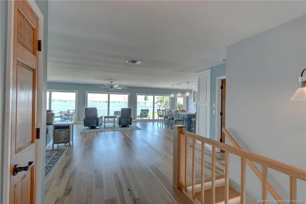 a view of a living room and hardwood floor